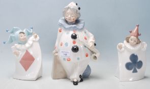 Three vintage 20th Century Valencian ceramic porcelain figurines comprising of a large clown holding