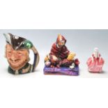 A collection of 20th century Royal Doulton figurines to include Robin Hood D6527, The Potter HN1493,