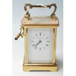 A mid 20th Century brass carriage clock retailed by Northern Goldsmiths Company having a carry