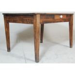 A Victorian 19th century country pine refectory dining table being raised on squared legs with
