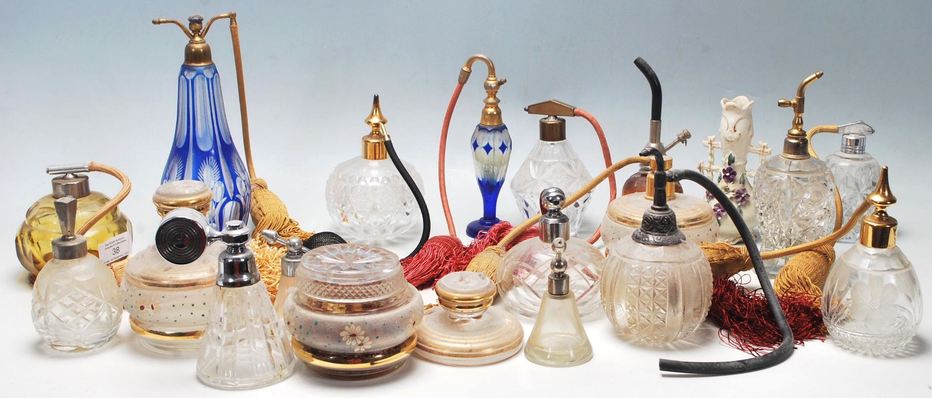 A collection of late early 20th Century Art Deco style perfume bottles of various shapes and