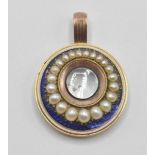 A 19th Century Victorian 9ct gold mourning pendant of round form being set with half seed pearls