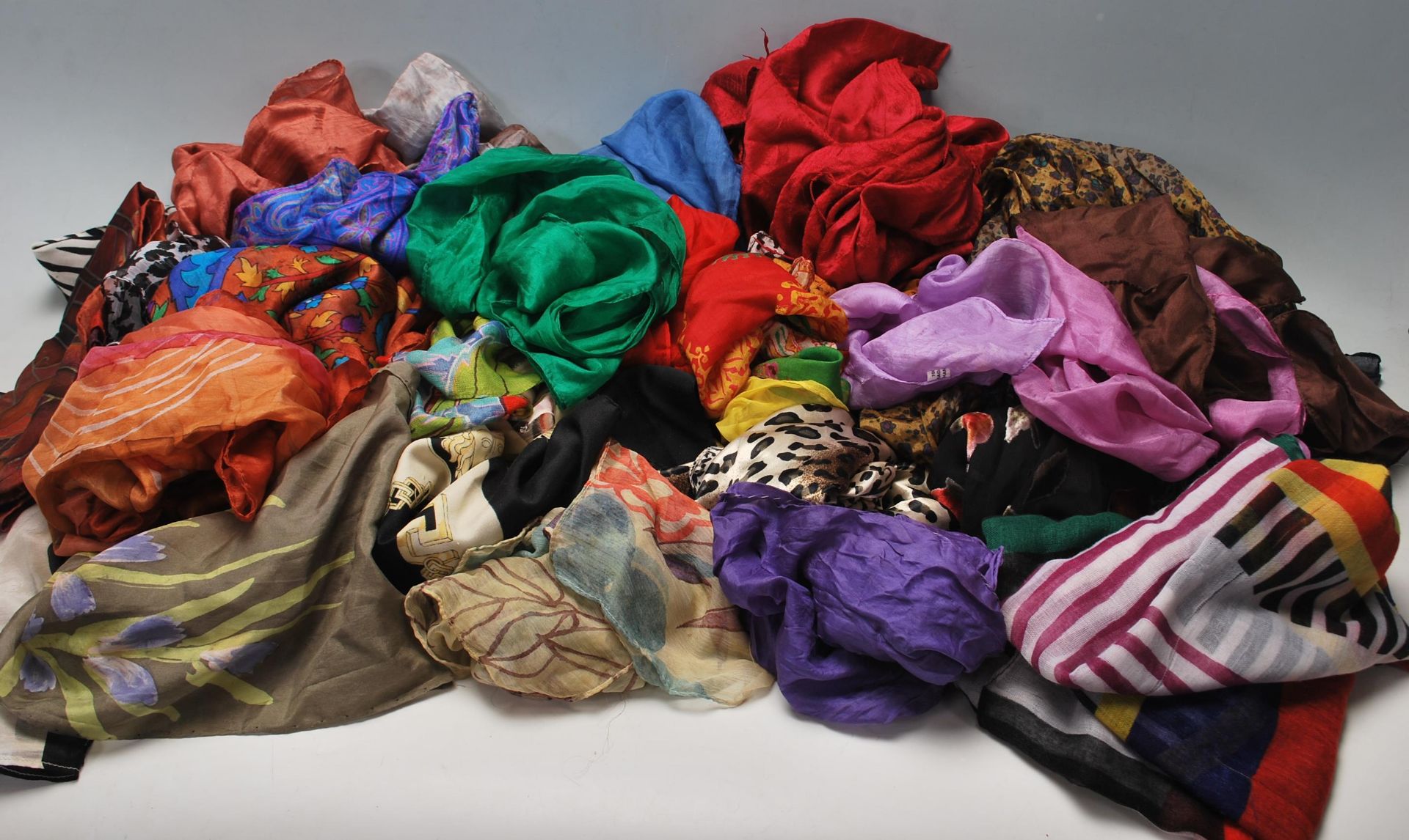 A collection of vintage ladies scarves to include some silk examples, various floral printed