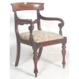 A  believed early 19th century Gillows of Lancaster mahogany carver armchair. The chair being raised