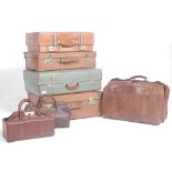 A good stack of vintage trunks and suitcases to include good leather example with monogram initials,