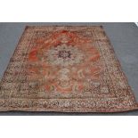 A large 20th century Persian / Islamic inspired woollen rug. The large floor carpet run with red