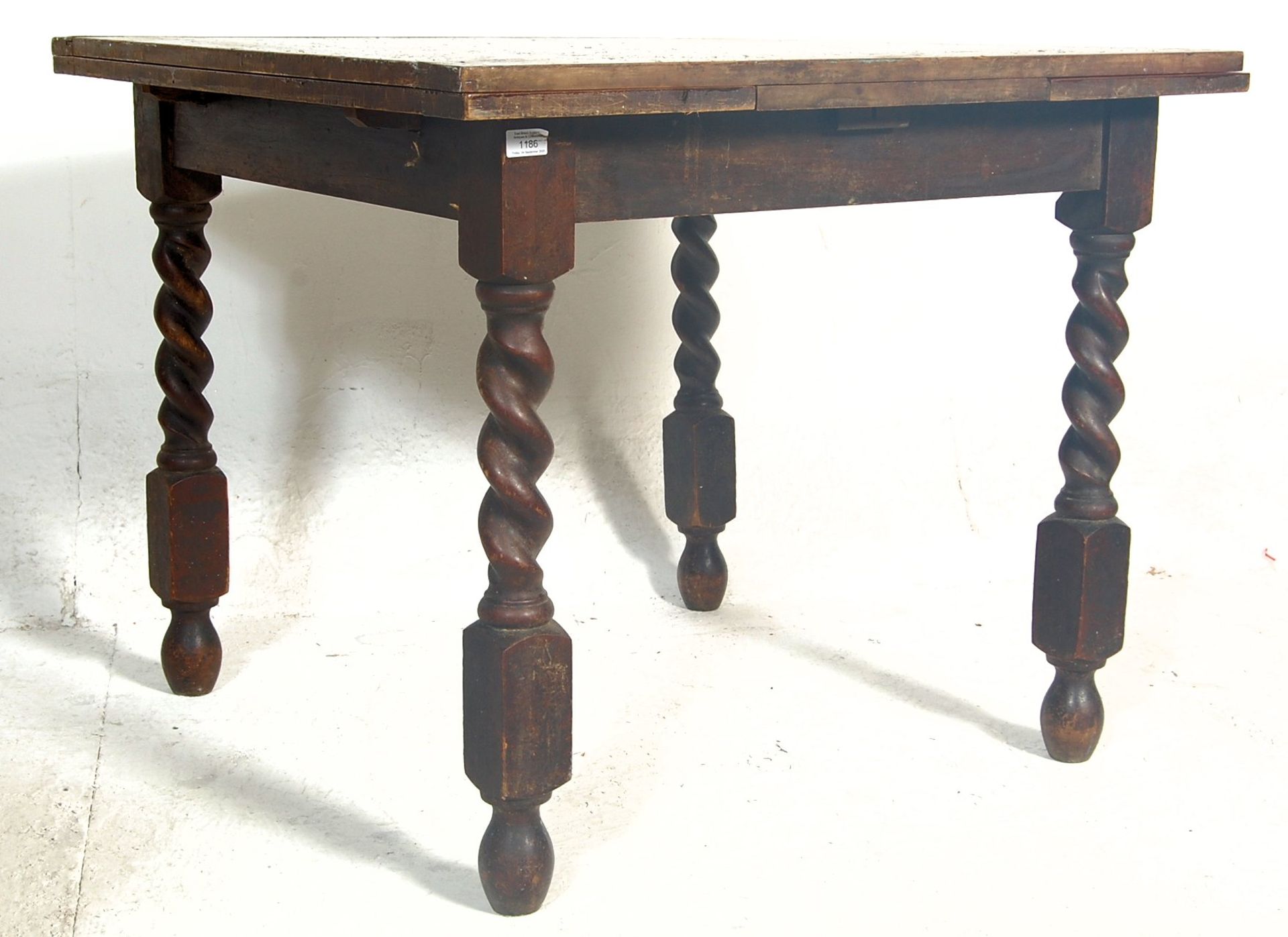 An early 20th Century draw leaf refectory dining t