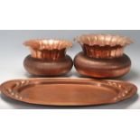 A collection of early 20th Century copperware to include a Newlyn style copper dish / plate together