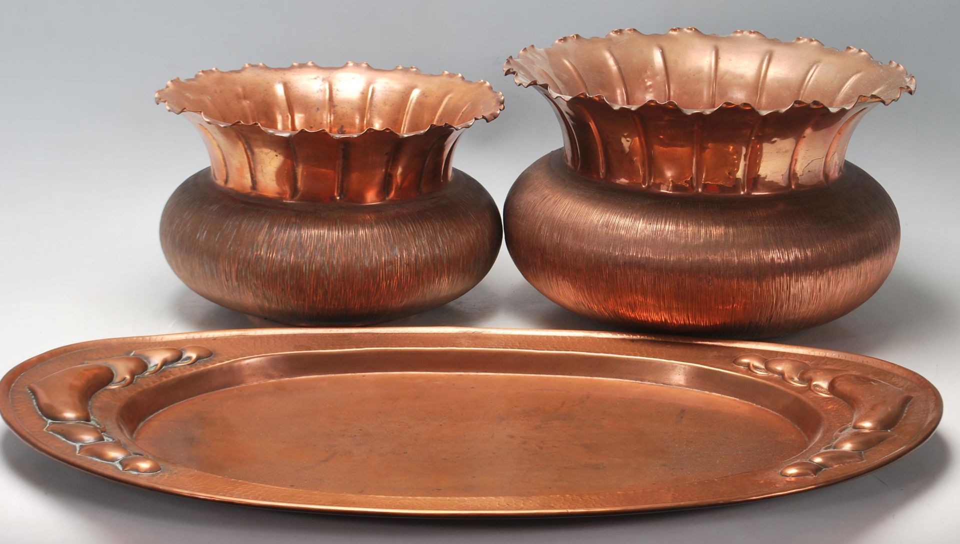 A collection of early 20th Century copperware to include a Newlyn style copper dish / plate together