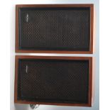 A pair of Sony SS - 210 teak wood cased hi-fi speakers with black facia’s bearing Sony labels.