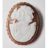 A hallmarked 9ct gold shell cameo brooch carved with a maiden. Stamped 9ct with a pin to verso.