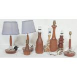 A COLLECTION OF SEVEN TEAK WOOD TABLE LAMPS