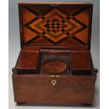 A 19th Century Victorian mahogany tea caddy of rectangular form having a hinge lid with ring handles