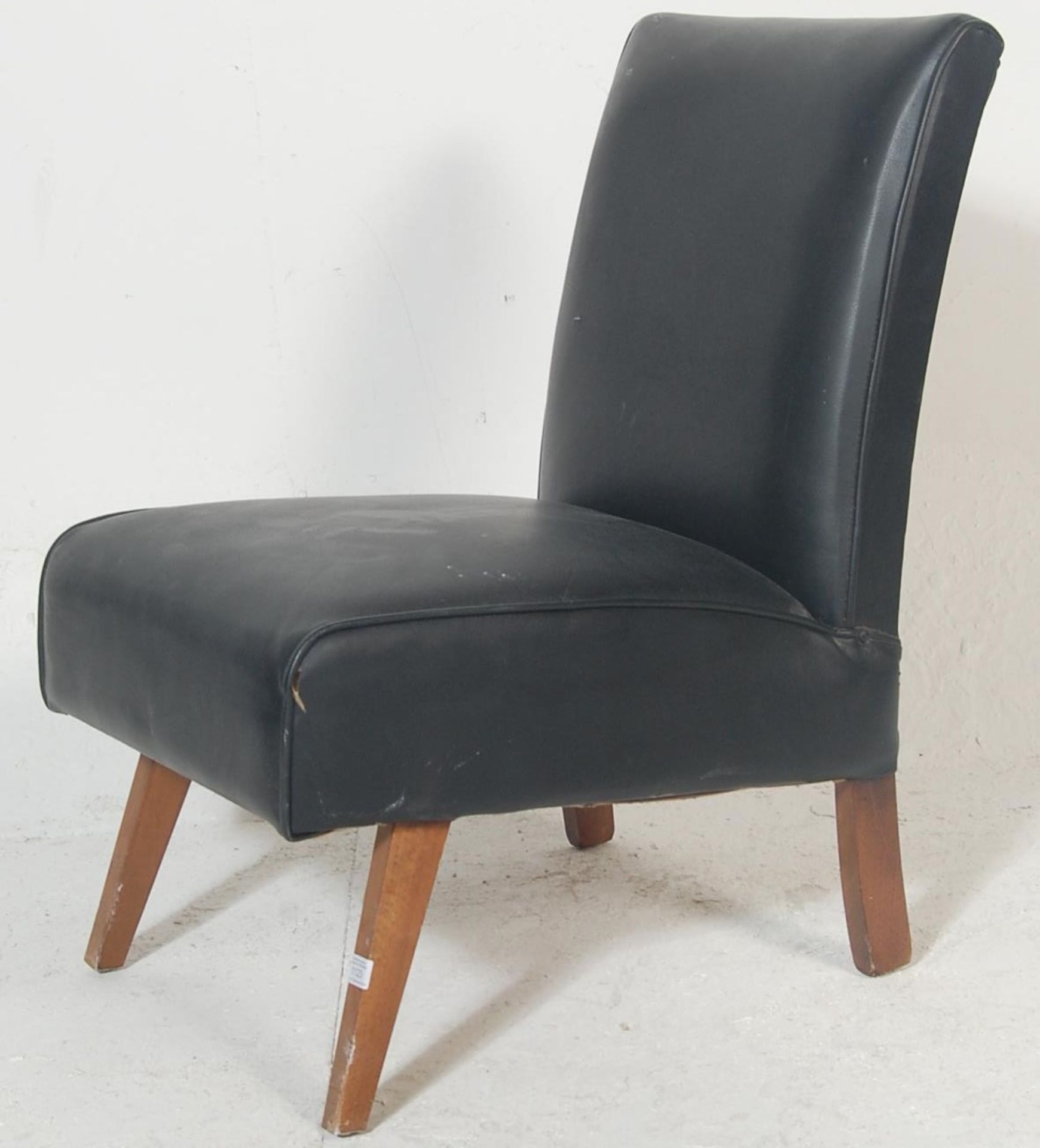 A vintage retro late 20th century bedroom chair having black leather upholstery raised on angular - Bild 4 aus 7