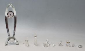 A collection of Swarovski cut crystal animal ornaments to include a fox, an owl, a kiwi bird, a