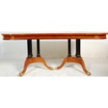 A large impressive regency revival dining table consisting of a maple, satinwood, ebony & boxwood