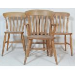 A collection of antique style 20th century Windsor kitchen dinning chairs raised on turned legs