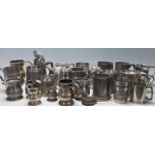 A collection of early 20th Century metalware & pewter drinking vessels / steins / flagons / jugs
