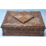 A 20th Century Black forest blackthorn wooden trinket / jewellery box of rectangular form having a