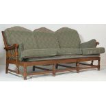 Ercol Furniture - A 20th century Old Colonial pattern 3 seat sofa settee in beech and elm wood.