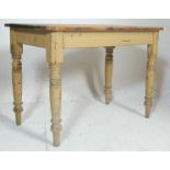 A Victorian 19th century pine scrub top refectory dining table being raised on turned legs and