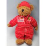 A vintage 20th century Michael Schumacher plush toy / bear with red Ferrari suit and Vodafone, Shell