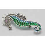 A silver 925 plique a jour pendant . brooch in the form of a seahorse with red stone eye having