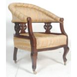 An Edwardian mahogany ebonised tub armchair - chair. Raised on serpentine legs with overstuffed seat