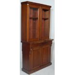 A Victorian 19th century mahogany library bookcase cupboard raised on a plinth base with single