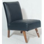 A vintage retro late 20th century bedroom chair having black leather upholstery raised on angular