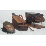 A collection of three 20th century antique foot action black smith belows / foot pumps having wooden