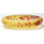 A 19th century French glass dish in the manner of Legras signed Tip. Of squat form with amber