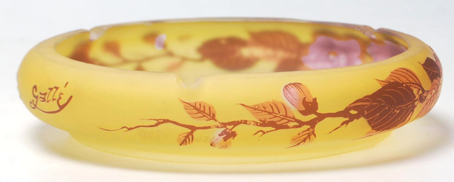 A 19th century French glass dish in the manner of Legras signed Tip. Of squat form with amber