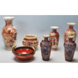 A collection of 20th Century Meiji revival period china comprising of three vases decorated with
