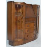 A 1930's Art Deco oak bureau bookcase - display cabinet. Raised on an inset plinth base with end