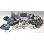 A collection of digital cameras and 35mm cameras to include Kodak easy share, Olympus C-310 zoom,