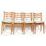 A set of 4 mid century Stoe of Yugoslavia beech wood dining chairs of utility form. Each with