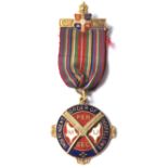 A hallmarked 9ct gold 1930's Independent Order of Oddfellows medal having blue and red enamelling on