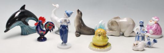 A collection West German Goebel and USSR Russian porcelain animals to include boy, elephant, seal,
