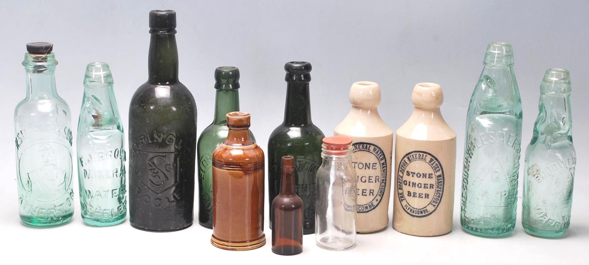 A collection of early 20th Century drinking vessels of various shapes and sizes to include stoneware