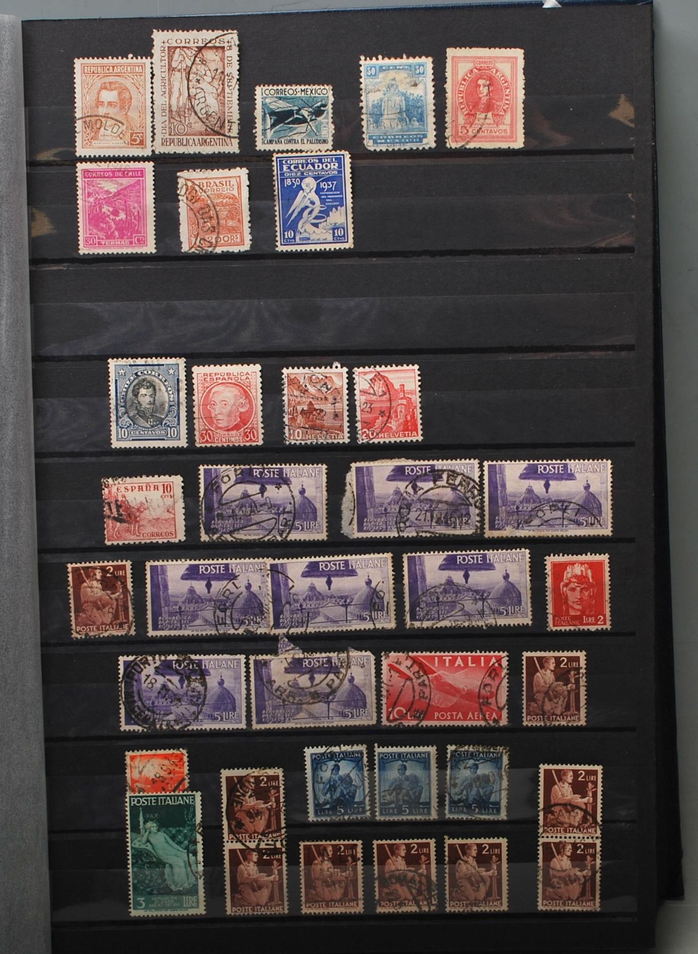 A good collection of early 20th century world stamps in a blue albums to include  include stamps