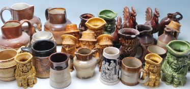 Large collection of 20th century antique lambeth stoneware jugs and cups having two tone colours