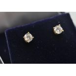 A pair of 18ct yellow  gold and diamond stud earrings with butterfly clasp. The diamonds approx