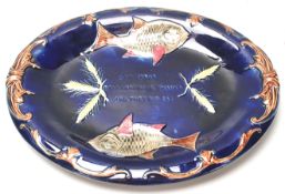 A 19th Century Victorian Joseph Holdcroft Majolica cobalt blue bread dish decorated with fish and