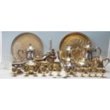 A large quantity of silver plated flatware comprising serving try, tea pot, toaster rack, creamer