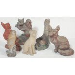 A large collection of vintage 20th century stone garden figurines / statues to include a fox, owl,