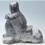 A good late 20th century vintage  eskimo / inuit steatite carving statue depicting a man with