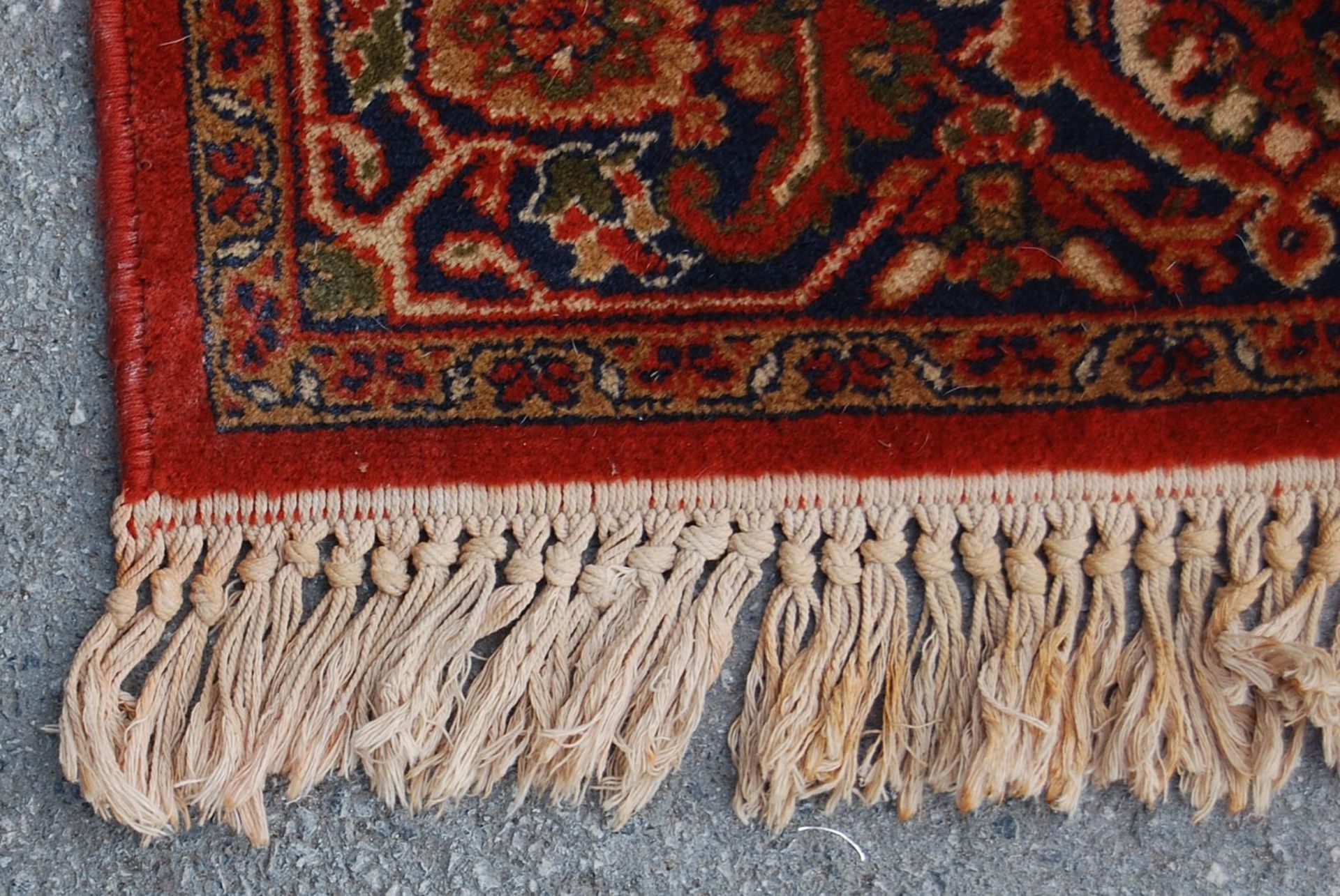 A 20th century Persian / Islamic Mashad Iranian floor rug having a central red ground with single - Image 3 of 4