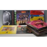 A collection of vintage records / 78's to include The Doors, Kiss, The Clash, Billy Bragg, Stray