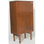 A retro mid century. circa 1950's Danish inspired teak wood cocktail / drinks cabinet. The cabinet